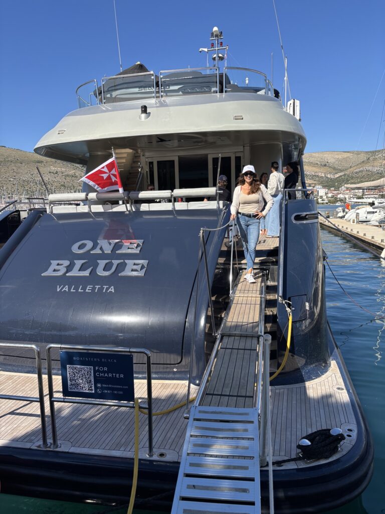 ONE BLUE moored stern-to, her name on the transom