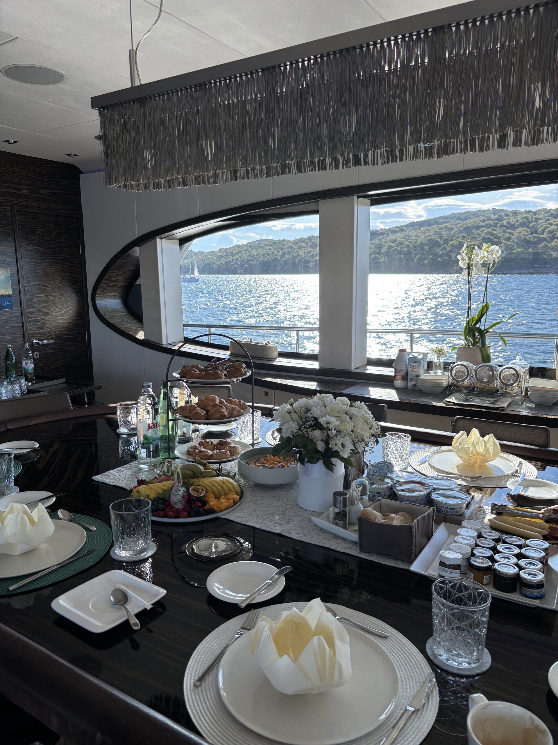 Breakfast laid out in the dining area with sea views