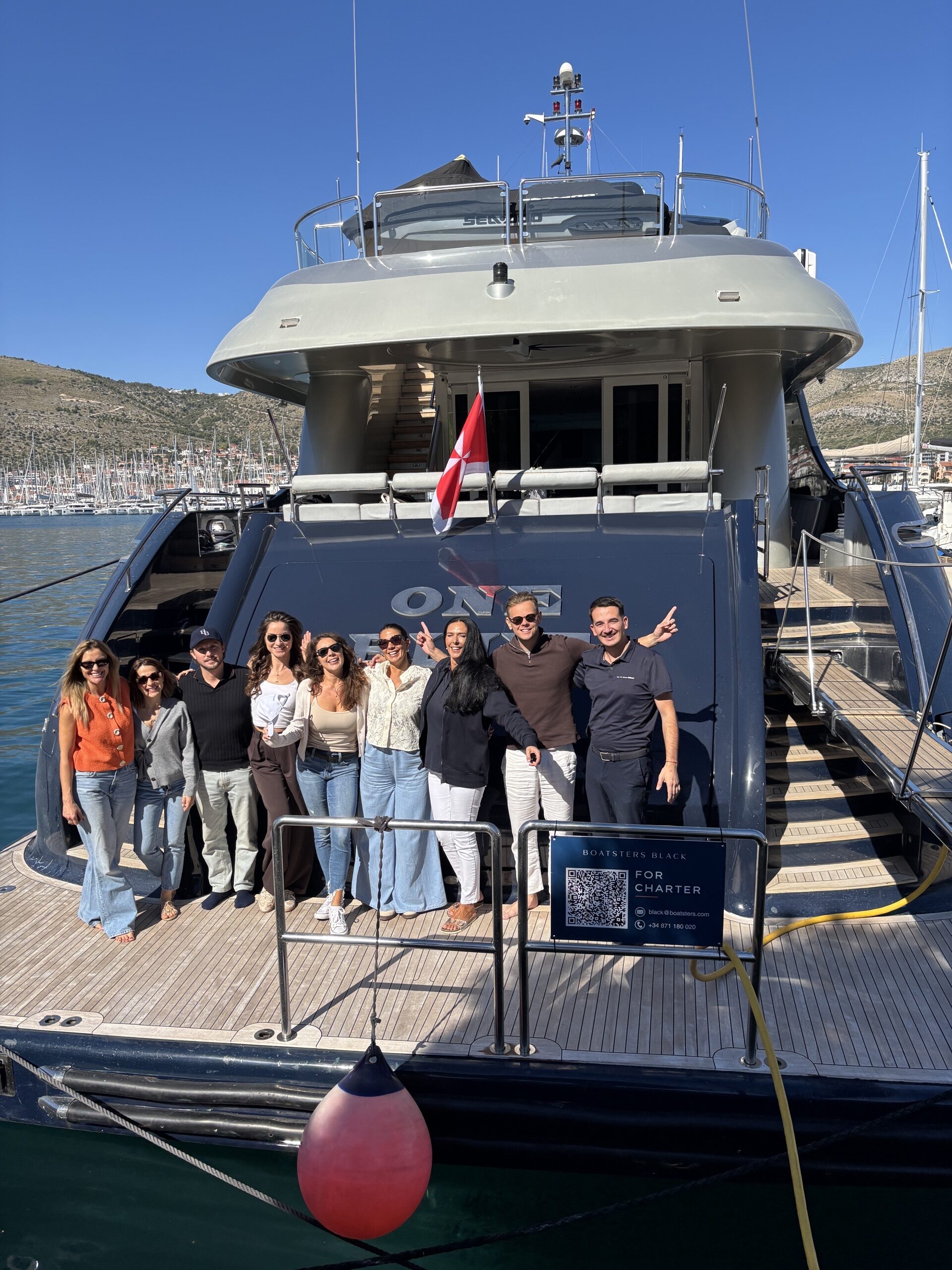 Brokers gathered on the aft deck of ONE BLUE