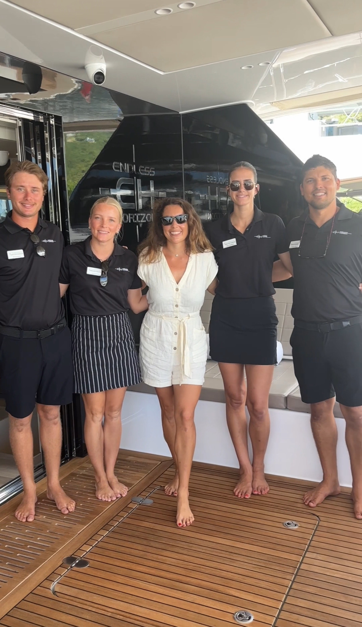 Alex with the crew of ENDLESS HORIZON on her aft deck