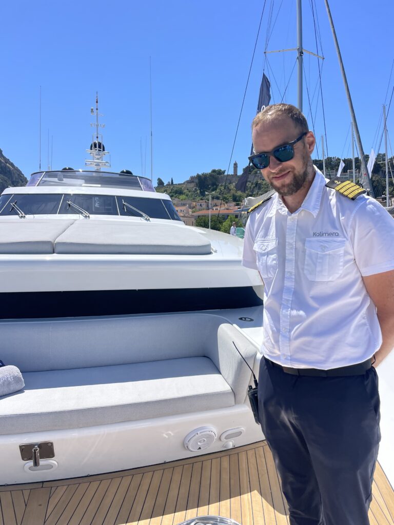 The captain of KALIMERA on her foredeck