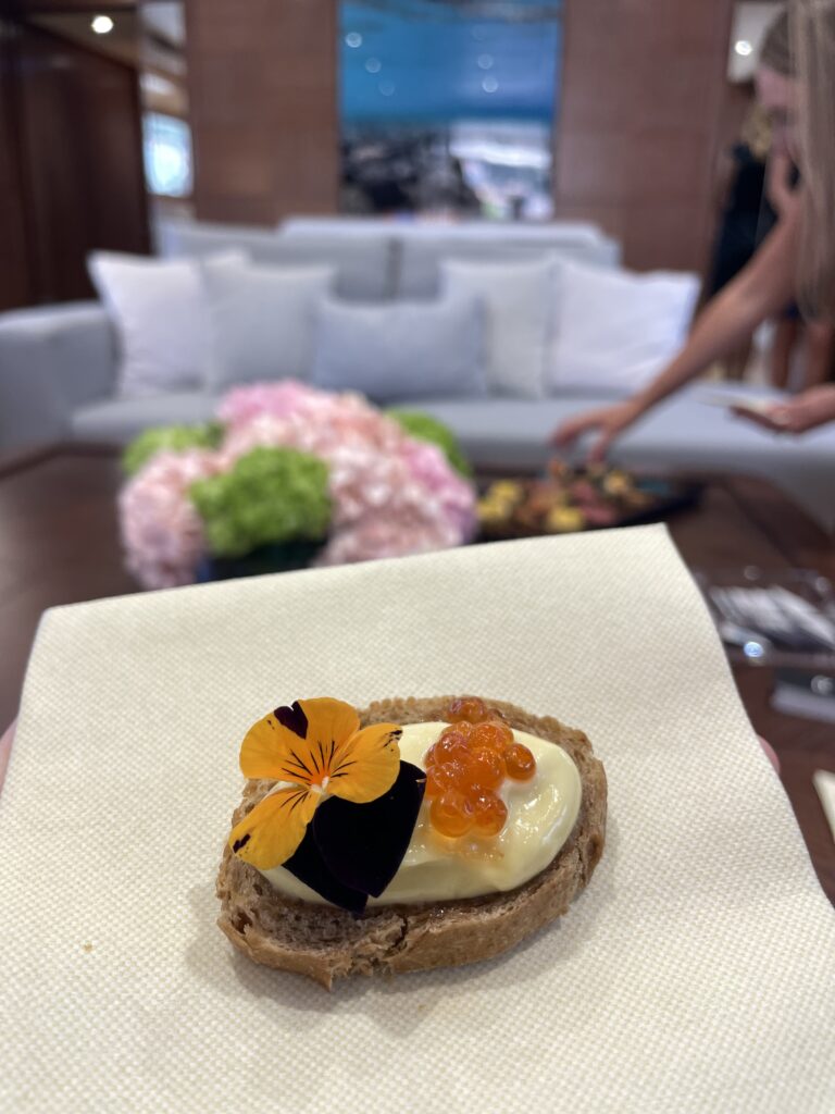 Canape with salmon roe served in the saloon of KALIMERA