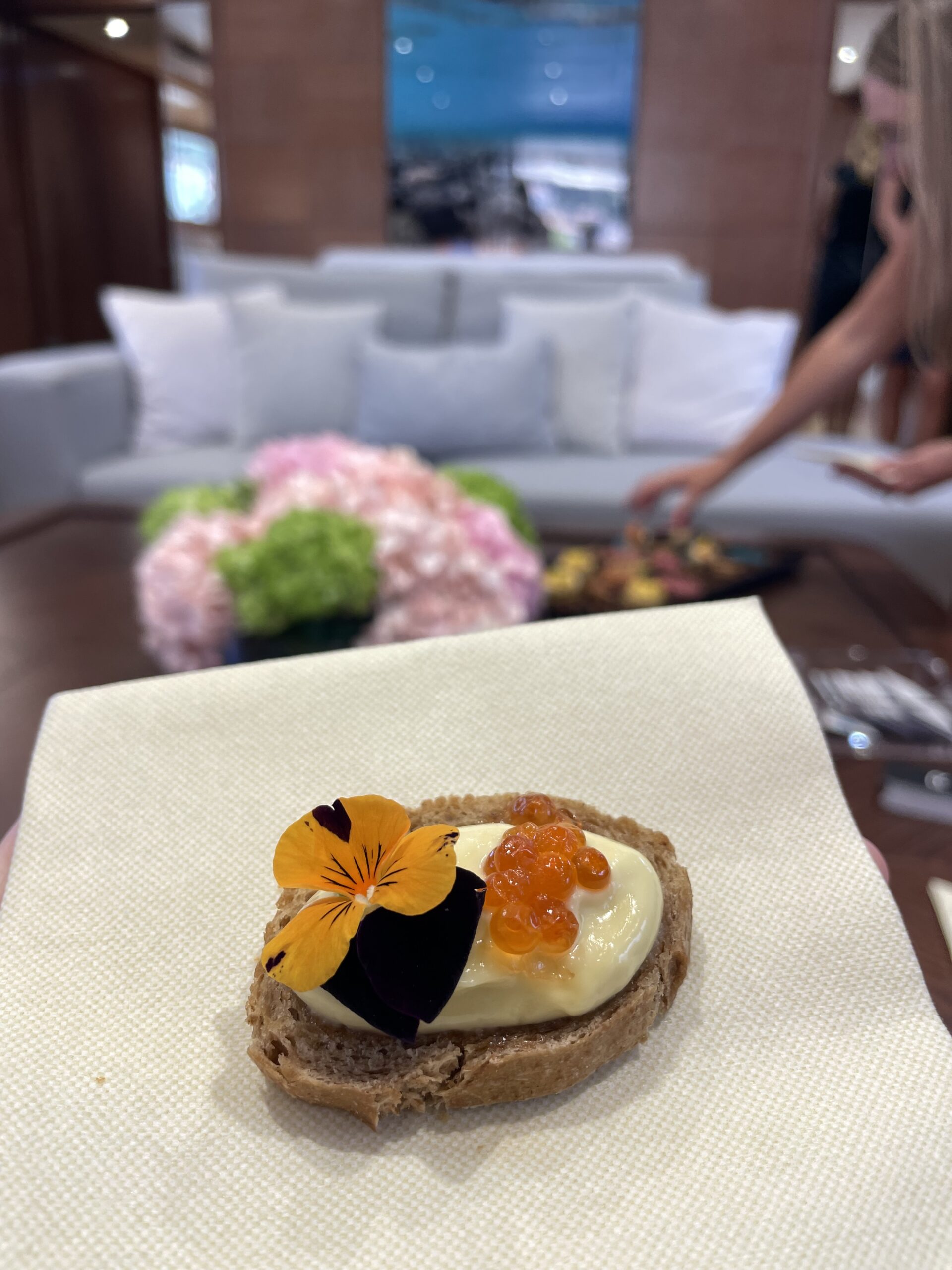 Canape with salmon roe served in the saloon of KALIMERA